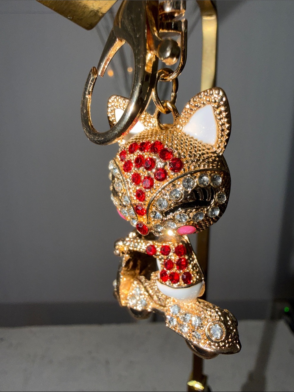 NWOT keychain/bag, charm, rhinestone and gold cat on a bicycle, movable head
